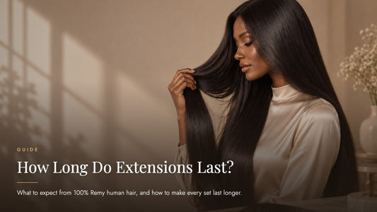 Woman with deep brown skin and long sleek jet-black hair lifting a section of hair in soft window light beside a clip-in weft, captioned How Long Do Extensions Last - Sandy Bella human hair extension lifespan guide