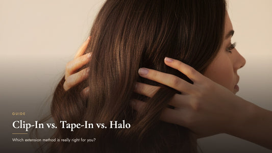 Close-up of a woman running her hands through long wavy brunette hair, cover image for the clip-in vs tape-in vs halo hair extensions comparison guide