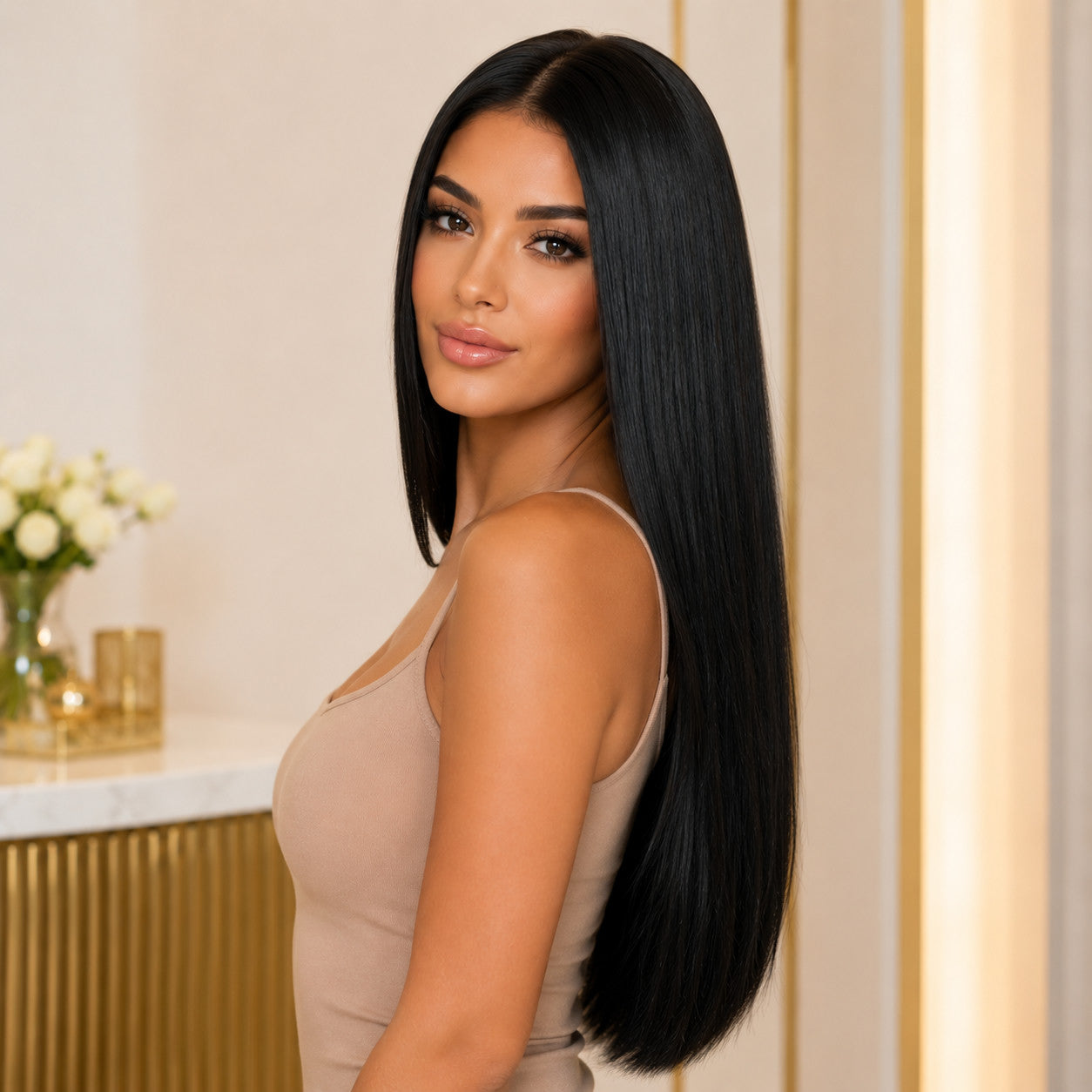 Model wearing #1 Black 20 inch clip-in extensions, side profile showing sleek length - Sandy Bella
